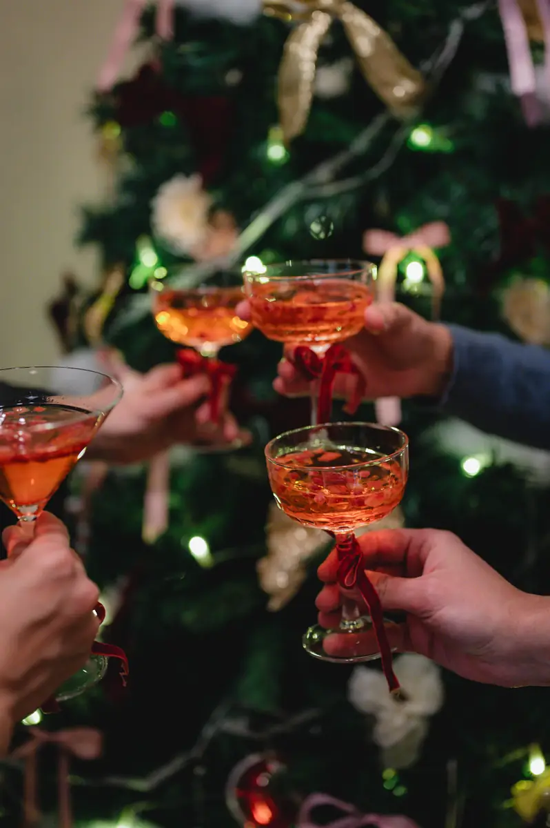 Cocktails raised by the Christmas tree